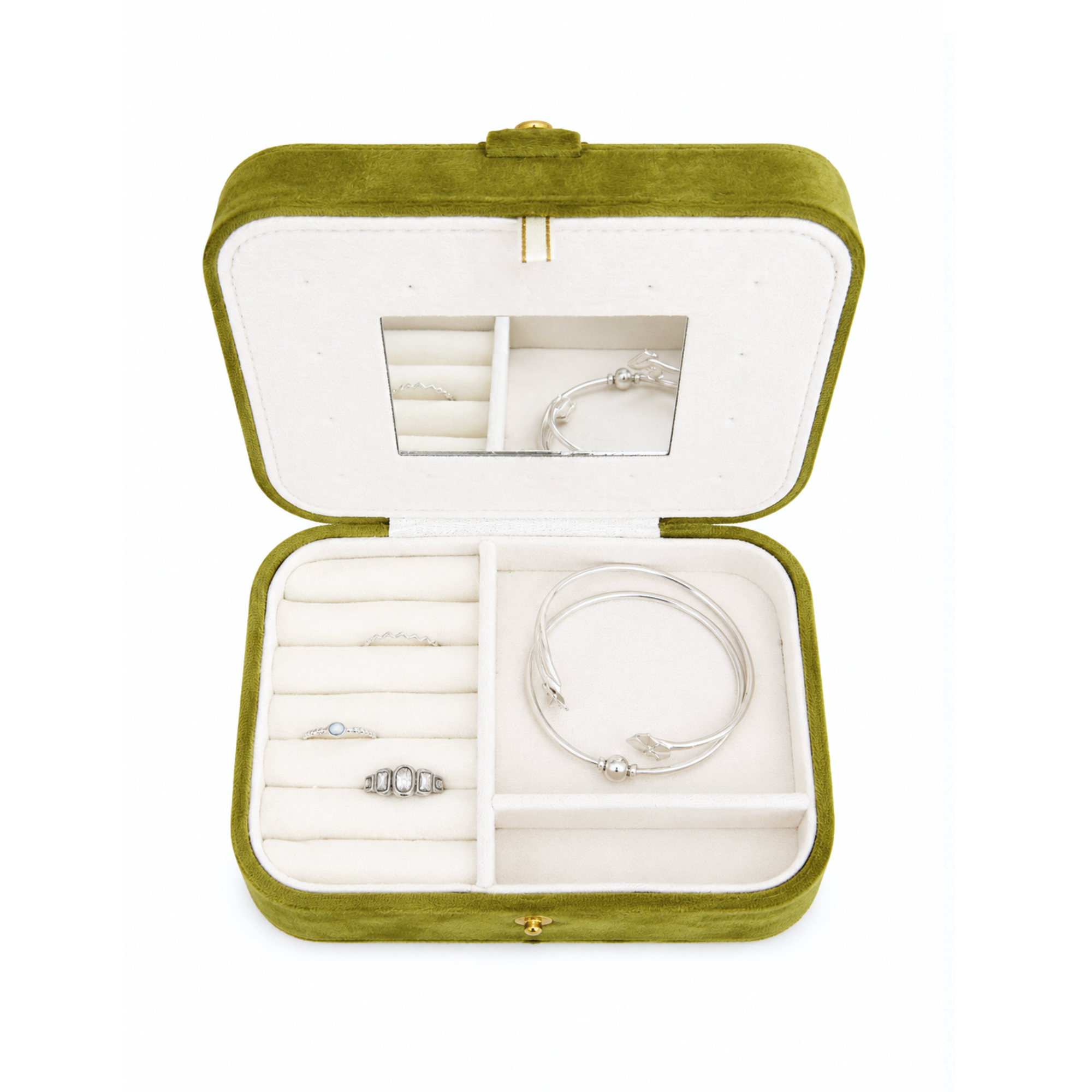 An open olive green velvet jewelry box with a white interior, containing silver rings and bracelets, set against a plain white background.