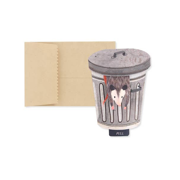 Cup with lid featuring a design of a possum in a trash can on a white background